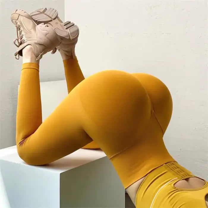 Yellow spandex bodysuit and athletic shoes with Ladies Chic Seamless Sculpt Leggings